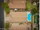 Aerial view of a home with a fenced yard, patio, and a shimmering blue pool at 4609 E Adobe Dr, Phoenix, AZ 85050