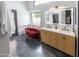 Stunning bathroom features a modern vanity, vibrant red tub and luxurious marble accents at 4609 E Adobe Dr, Phoenix, AZ 85050