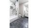 Bright bathroom features a bathtub with marble accents, a toilet, and modern vanity at 4609 E Adobe Dr, Phoenix, AZ 85050