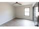 Cozy bedroom with a window, ceiling fan, and light wood flooring at 4609 E Adobe Dr, Phoenix, AZ 85050