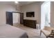 Primary bedroom with custom dresser, luxury vinyl flooring, and plenty of closet space at 4609 E Adobe Dr, Phoenix, AZ 85050