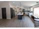 Contemporary kitchen boasts a center island, modern lighting, and stainless steel appliances at 4609 E Adobe Dr, Phoenix, AZ 85050