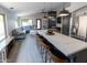 Open concept kitchen features an island with marble countertops and modern pendant lighting at 4609 E Adobe Dr, Phoenix, AZ 85050