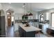 Bright kitchen features an island with bar seating, stainless steel appliances, and modern finishes at 4609 E Adobe Dr, Phoenix, AZ 85050