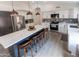 Modern kitchen featuring a central island, stainless steel appliances, and pendant lighting at 4609 E Adobe Dr, Phoenix, AZ 85050