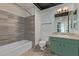 Bathroom features tile flooring, a shower-tub combo, and a single sink vanity at 4750 N Central Ave # G3, Phoenix, AZ 85012