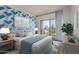 Comfortable bedroom features a statement wall, soft natural light, and a private balcony at 4750 N Central Ave # G3, Phoenix, AZ 85012