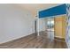Large bedroom features hardwood floors, a wall closet with mirrored doors, and balcony access at 4750 N Central Ave # G3, Phoenix, AZ 85012