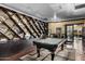 Game room features billiard table, dark wood shelving and neutral-colored walls at 4750 N Central Ave # G3, Phoenix, AZ 85012