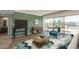 Bright living room with large windows showcasing a view and stylish, comfortable furniture at 4750 N Central Ave # G3, Phoenix, AZ 85012