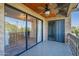 Balcony features sliding glass doors and decorative railing at 4950 N Miller Rd # 233, Scottsdale, AZ 85251