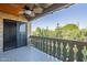 The balcony overlooks greenery and includes a ceiling fan at 4950 N Miller Rd # 233, Scottsdale, AZ 85251