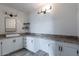The space features built-in cabinets, a bar counter, stylish lighting, and a mirror at 4950 N Miller Rd # 233, Scottsdale, AZ 85251