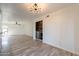 Living room featuring wood floors, a ceiling fan, a built-in bar, and recessed lighting at 4950 N Miller Rd # 233, Scottsdale, AZ 85251