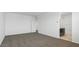 Bright bedroom featuring neutral colored walls and carpeting at 5058 E Umber Rd, San Tan Valley, AZ 85143
