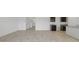 Open living space with tile floors leading to a kitchen with dark wood cabinets at 5058 E Umber Rd, San Tan Valley, AZ 85143
