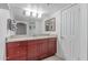 Bathroom features a wood vanity with granite countertop and a large mirror at 5104 N 32Nd St # 144, Phoenix, AZ 85018