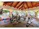 Bright fitness center with multiple exercise machines, weights, and a vaulted wooden ceiling at 5104 N 32Nd St # 144, Phoenix, AZ 85018