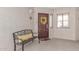 Inviting front door with a cheerful wreath and bench, creating a warm and welcoming entrance at 5104 N 32Nd St # 144, Phoenix, AZ 85018