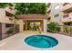 Community hot tub surrounded by a privacy fence at 5104 N 32Nd St # 144, Phoenix, AZ 85018