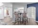 The view looking from the living area through the kitchen, which features modern appliances and barstool seating at 5104 N 32Nd St # 144, Phoenix, AZ 85018