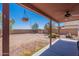 The backyard is spacious and has a covered patio with a ceiling fan at 5305 E Silverbell Rd, San Tan Valley, AZ 85143