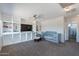 Spacious room with built-in shelving, ceiling fan, and light blue baby furniture at 5305 E Silverbell Rd, San Tan Valley, AZ 85143