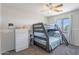 Cozy bedroom featuring a bunk bed, dresser, and ceiling fan at 5305 E Silverbell Rd, San Tan Valley, AZ 85143