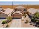 This home features desert landscaping and a spacious two-car garage at 5305 E Silverbell Rd, San Tan Valley, AZ 85143