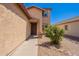 Inviting front entrance with a covered porch and landscaped yard at 5305 E Silverbell Rd, San Tan Valley, AZ 85143