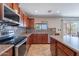 Modern kitchen featuring stainless steel appliances, granite countertops, and mosaic backsplash at 5305 E Silverbell Rd, San Tan Valley, AZ 85143