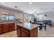 Open-concept kitchen with center island, stainless steel appliances, and eat-in dining area at 5305 E Silverbell Rd, San Tan Valley, AZ 85143