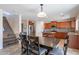 Eat-in kitchen with stairs, stainless appliances, and wood cabinets at 5305 E Silverbell Rd, San Tan Valley, AZ 85143