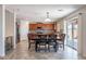 Eat-in kitchen features stainless appliances, wood cabinets, and dining area at 5305 E Silverbell Rd, San Tan Valley, AZ 85143