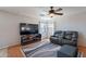 Cozy living room with TV, seating, and natural light at 5305 E Silverbell Rd, San Tan Valley, AZ 85143