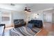 Spacious living area with an open floor plan with hardwood floors and lots of seating at 5305 E Silverbell Rd, San Tan Valley, AZ 85143