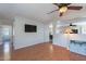 Comfortable living room with hardwood floors, TV, and an open floor plan at 5305 E Silverbell Rd, San Tan Valley, AZ 85143