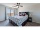 Comfortable main bedroom with ceiling fan, bedside tables, and outdoor views at 5305 E Silverbell Rd, San Tan Valley, AZ 85143