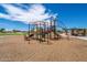 A colorful playground with slides, climbers, and swings for children to enjoy at 5305 E Silverbell Rd, San Tan Valley, AZ 85143