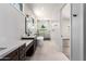 Modern bathroom featuring dual sink vanity, standalone tub, and glass-enclosed shower with elegant finishes at 5440 E Calle Camelia --, Phoenix, AZ 85018