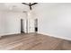 Bright, spacious bedroom with hardwood floors, and ensuite bathroom with a modern vanity at 5440 E Calle Camelia --, Phoenix, AZ 85018
