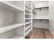 Spacious walk-in closet with built-in shelving, providing ample storage space for an organized wardrobe at 5440 E Calle Camelia --, Phoenix, AZ 85018