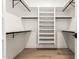 Walk-in closet with a spacious layout, built-in shelving, and modern design features at 5440 E Calle Camelia --, Phoenix, AZ 85018