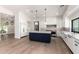 Bright, open kitchen with a large center island, modern appliances, and sleek white cabinetry at 5440 E Calle Camelia --, Phoenix, AZ 85018