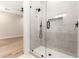 Contemporary glass enclosed shower, with white subway tile and a black shower fixture at 5440 E Calle Camelia --, Phoenix, AZ 85018