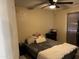 Bedroom with neutral walls, ceiling fan, carpet, and a double bed at 6711 W Osborn Rd # 138, Phoenix, AZ 85033