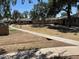 Apartment complex exterior featuring mature trees and well-maintained sidewalks at 6711 W Osborn Rd # 138, Phoenix, AZ 85033