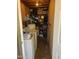 Utility room with washer, dryer, and storage shelves for household items at 6711 W Osborn Rd # 138, Phoenix, AZ 85033