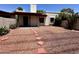 Single-story home with desert landscaping, a covered porch, and a stone walkway at 6845 W Caron Dr, Peoria, AZ 85345