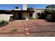 Charming home with desert landscaping in the front yard and covered porch at 6845 W Caron Dr, Peoria, AZ 85345